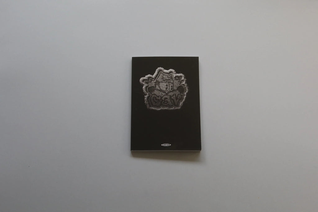 Misssiones CAVIAR photography art book with a minimalist black cover and a striking textured silver logo