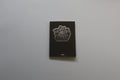Misssiones CAVIAR photography art book with a minimalist black cover and a striking textured silver logo