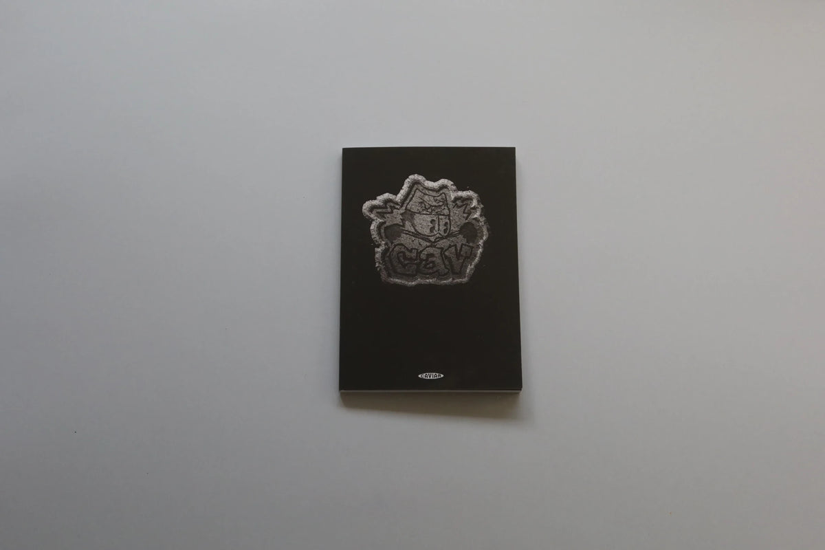 Misssiones CAVIAR photography art book with a minimalist black cover and a striking textured silver logo